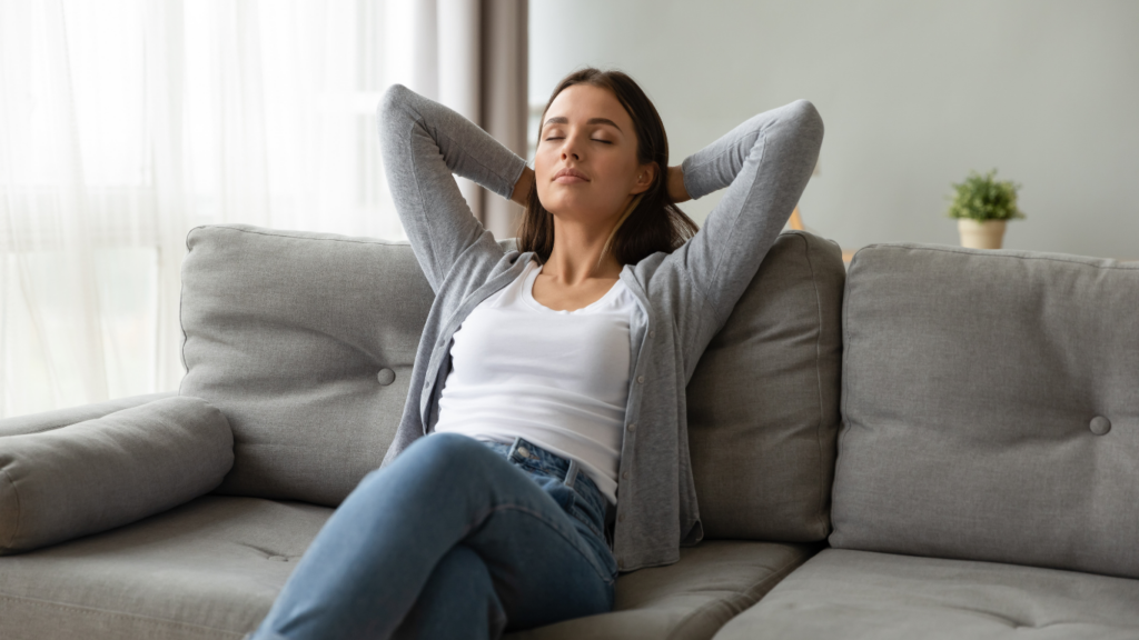 Relaxed woman sitting on couch