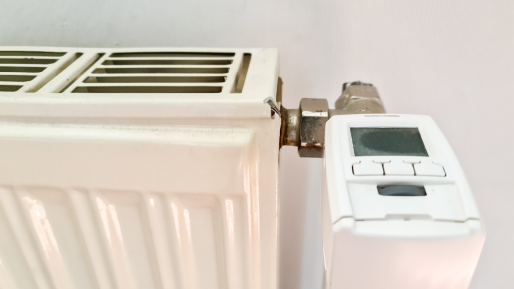 White radiator with digital thermostat